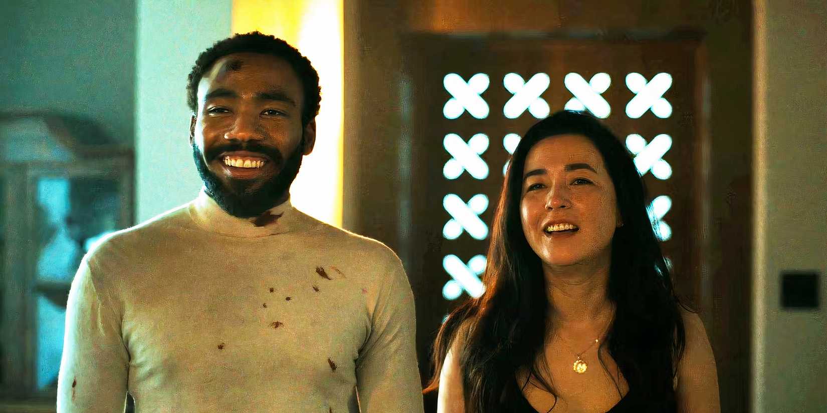 Donald Glover and Maya Erskine in John and Jane laughing together in Mr. & Mrs. Smith episode 8
