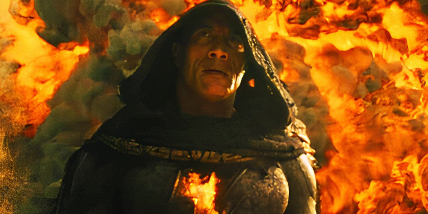 Dwayne Johnson as Black Adam in front of an explosion in Black Adam