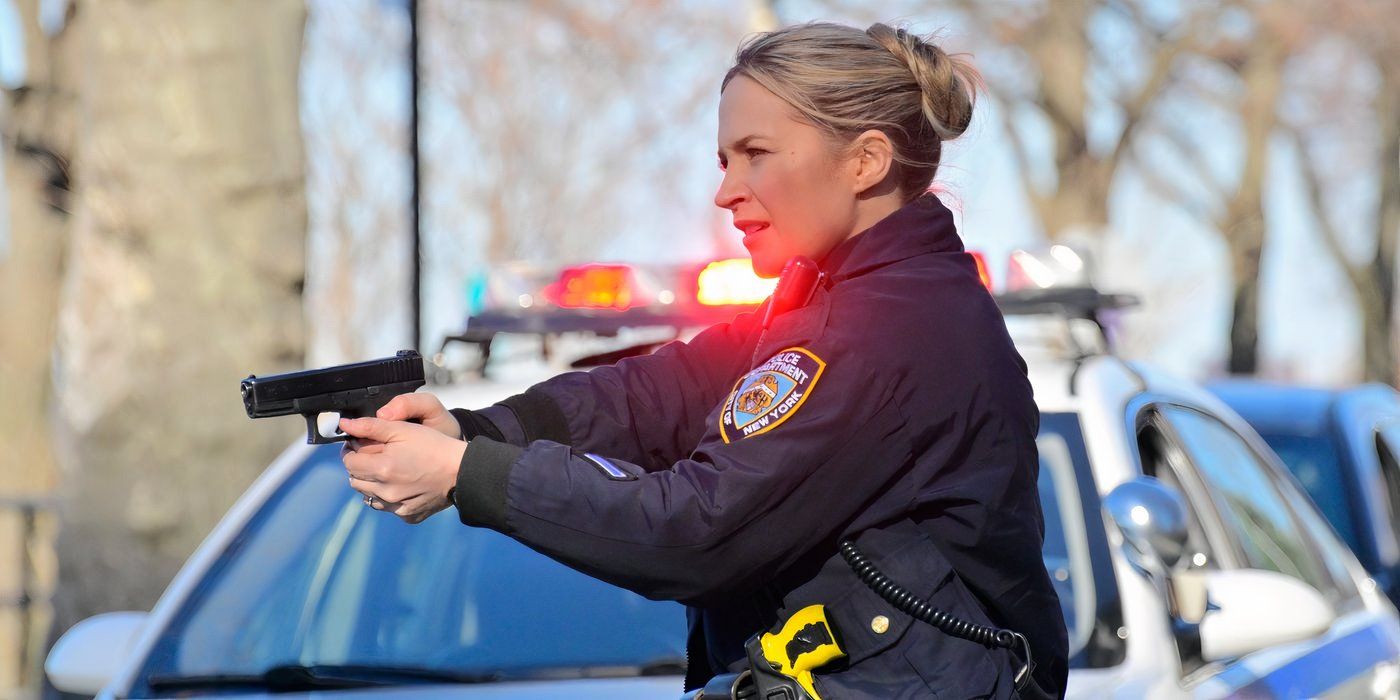 Eddie Janko (Vanessa Ray) pointing a gun in Blue Bloods.