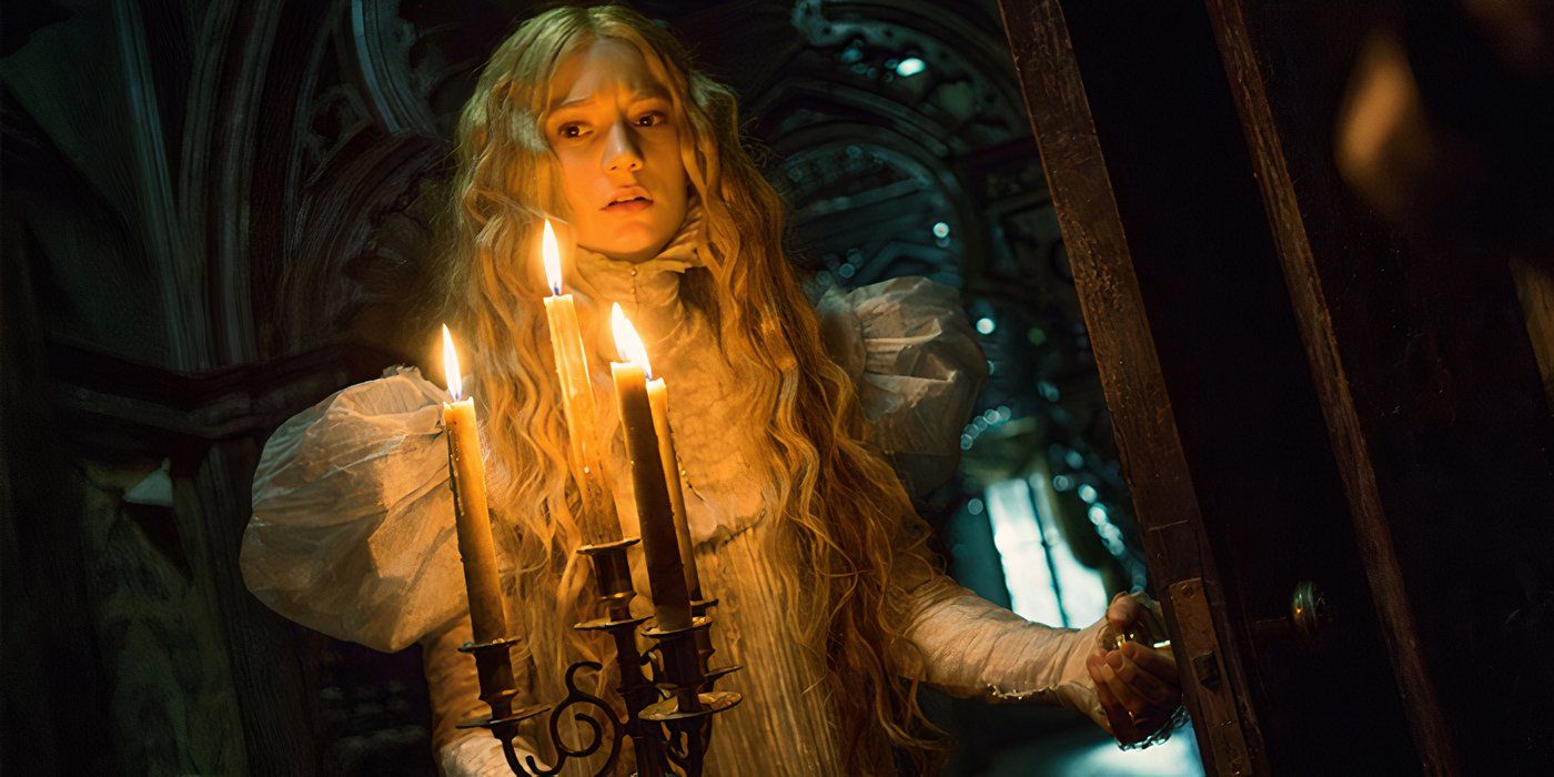 Edith walking with a lantern in Crimson Peak