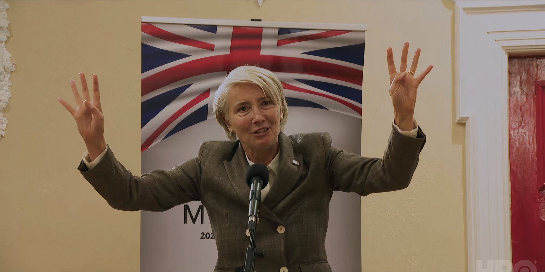 Emma Thompson as Viv Rook holding her arms up as she gives a speech in Years and Years.