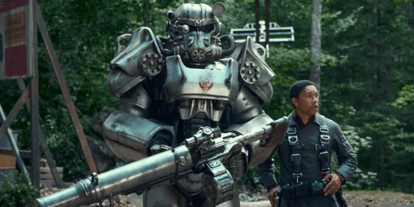 Fallout tv show series armor holding a Minigun