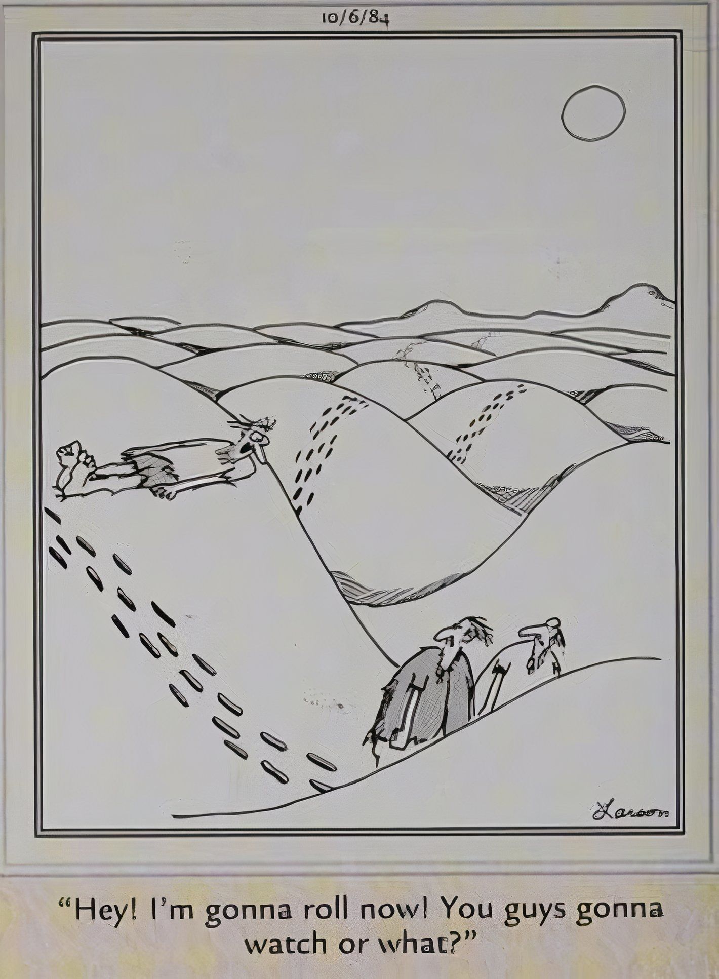 Far Side, man about to roll down a sand dune as his friends look on
