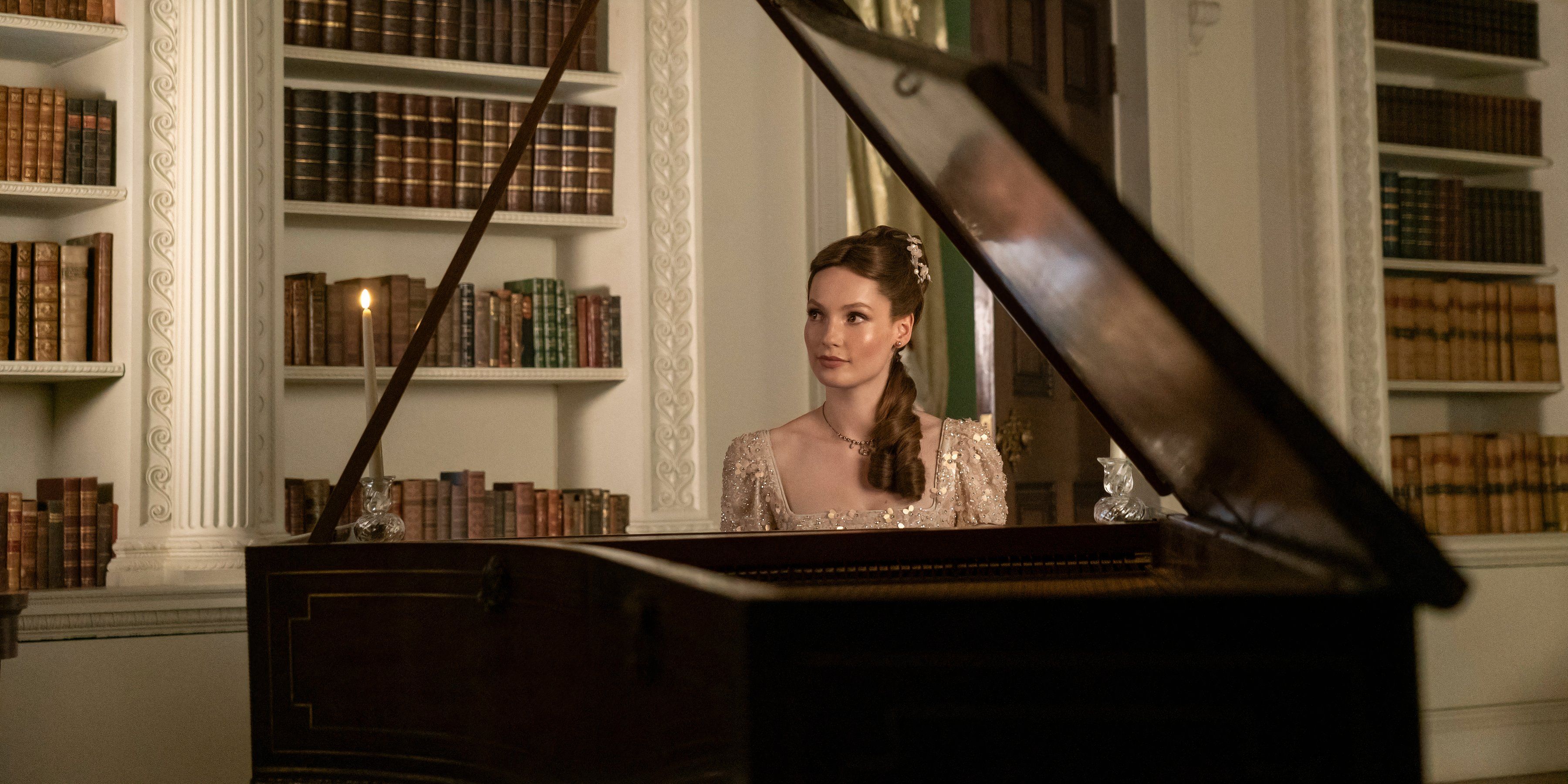 Francesca Bridgerton sits at the piano in Bridgerton season 3 still