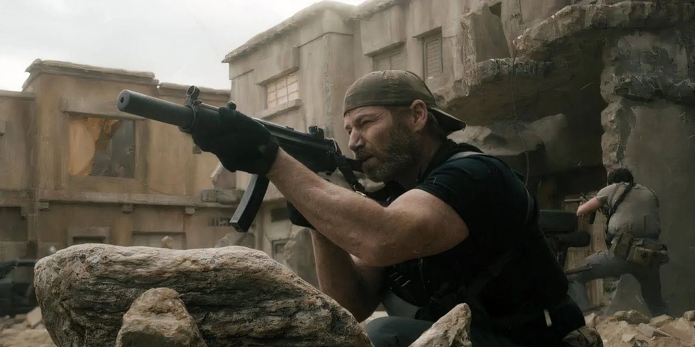 Full Metal (Scott Foxx) aiming with a gun behind some rubble in SEAL Team.