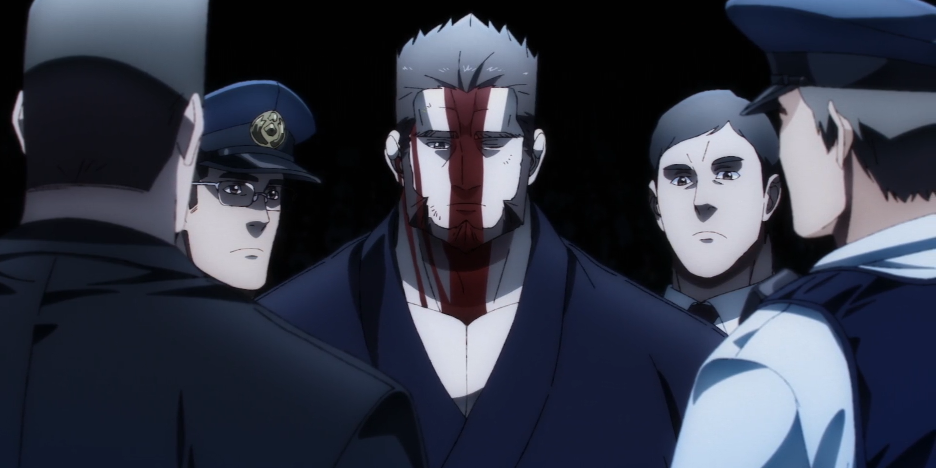 Juzo, face covered in blood, stands exhausted but accepting of his face as he his surrounded by police officers.