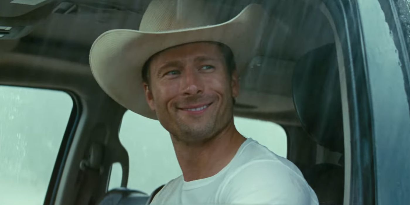 Glen Powell as Tyler Owens Wearing a Cowboy Hat in His Truck in Twisters