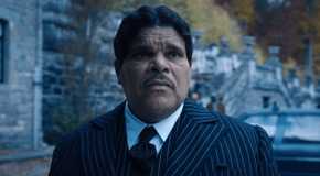 Gomez Addams looking into the distance in Wednesday.