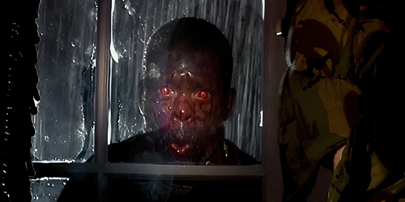Red eyed Zombie in 28 Days Later looks through the window in the rain