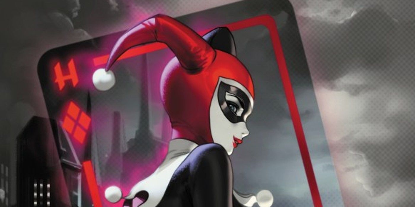 Harley Quinn stands in front of a see-through playing card, Gotham in the background