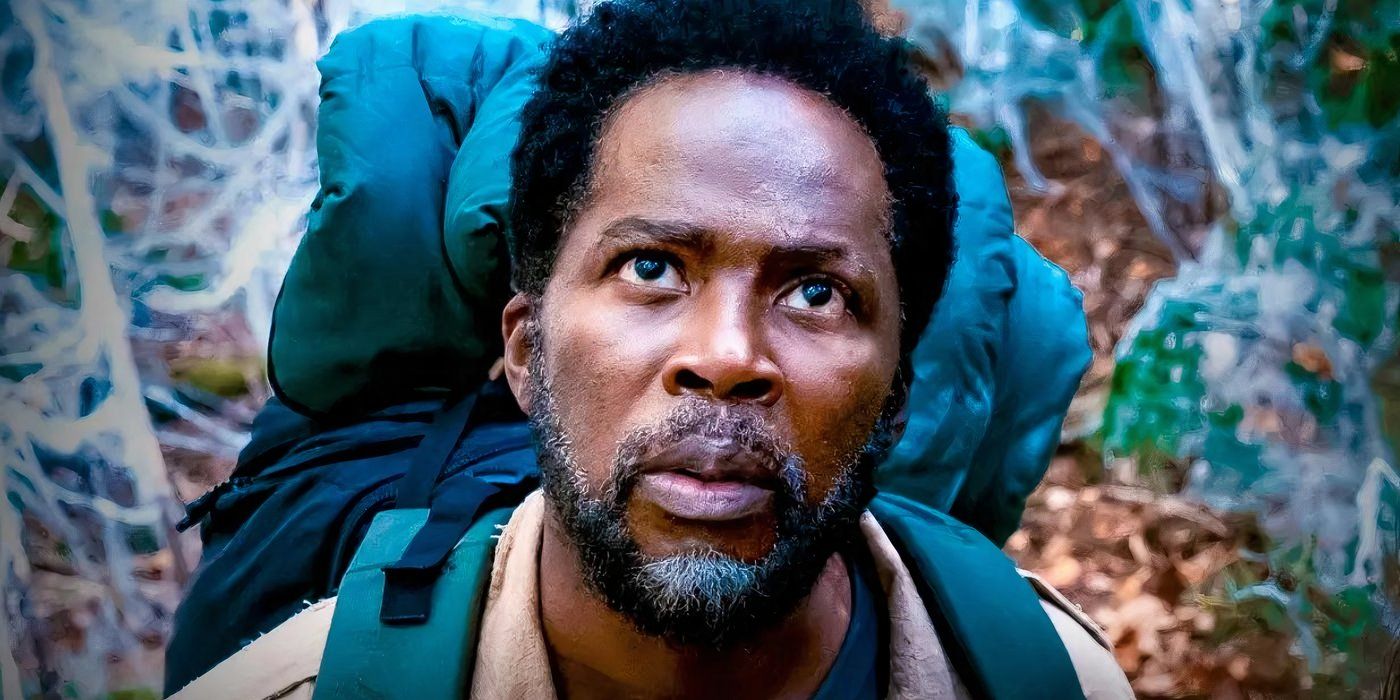 Harold Perrineau as Boyd Stevens looks up in awe while hiking through the woods in From