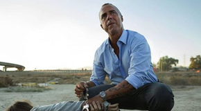 Harry Bosch (Titus Welliver) putting handcuffs on a guy in Bosch season 7