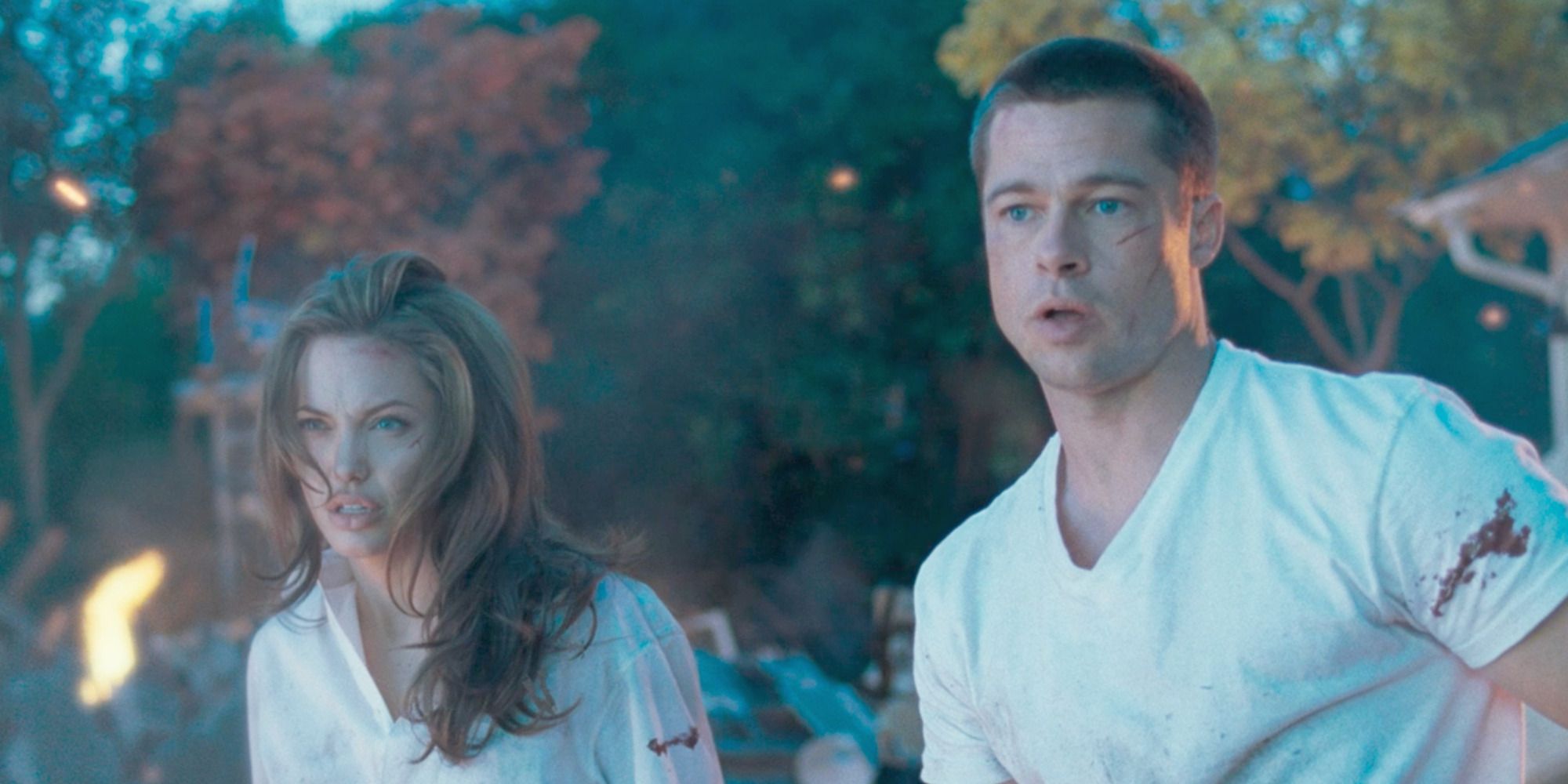 Jane (Angelina Jolie) and John (Brad Pitt) watch their burning home on Mr. & Mrs. Smith
