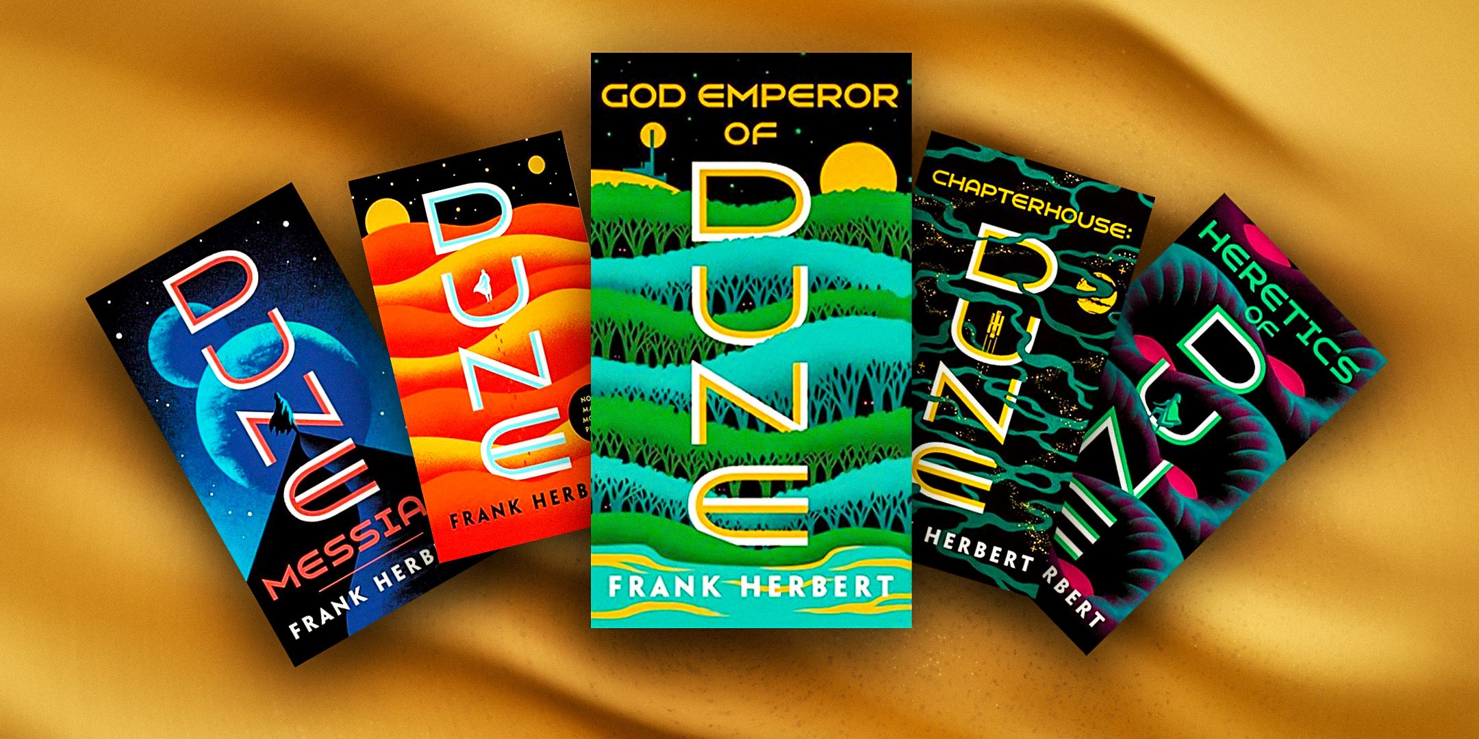 Several of Frank Herbert's Dune books with sand background