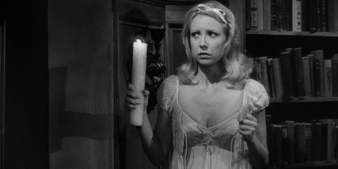 Inga (Teri Garr) holding a candle and looking scared in Young Frankenstein