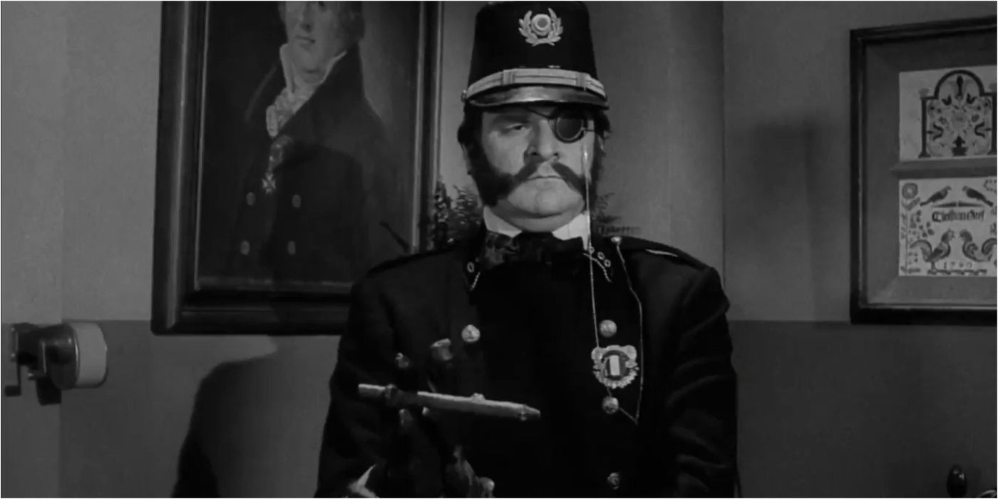 Inspector Kemp (Kenneth Mars) standing straight and looking serious in Young Frankenstein