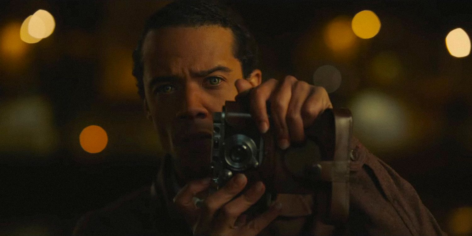 Louis de Pointe du Lac (Jacob Anderson) about to take a photo in Interview with the Vampire season 2
