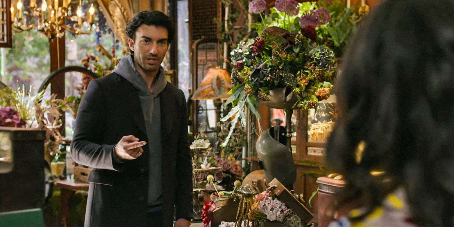 Ryle Kincaid (Justin Baldoni) enters a flower shop in It Ends With Us