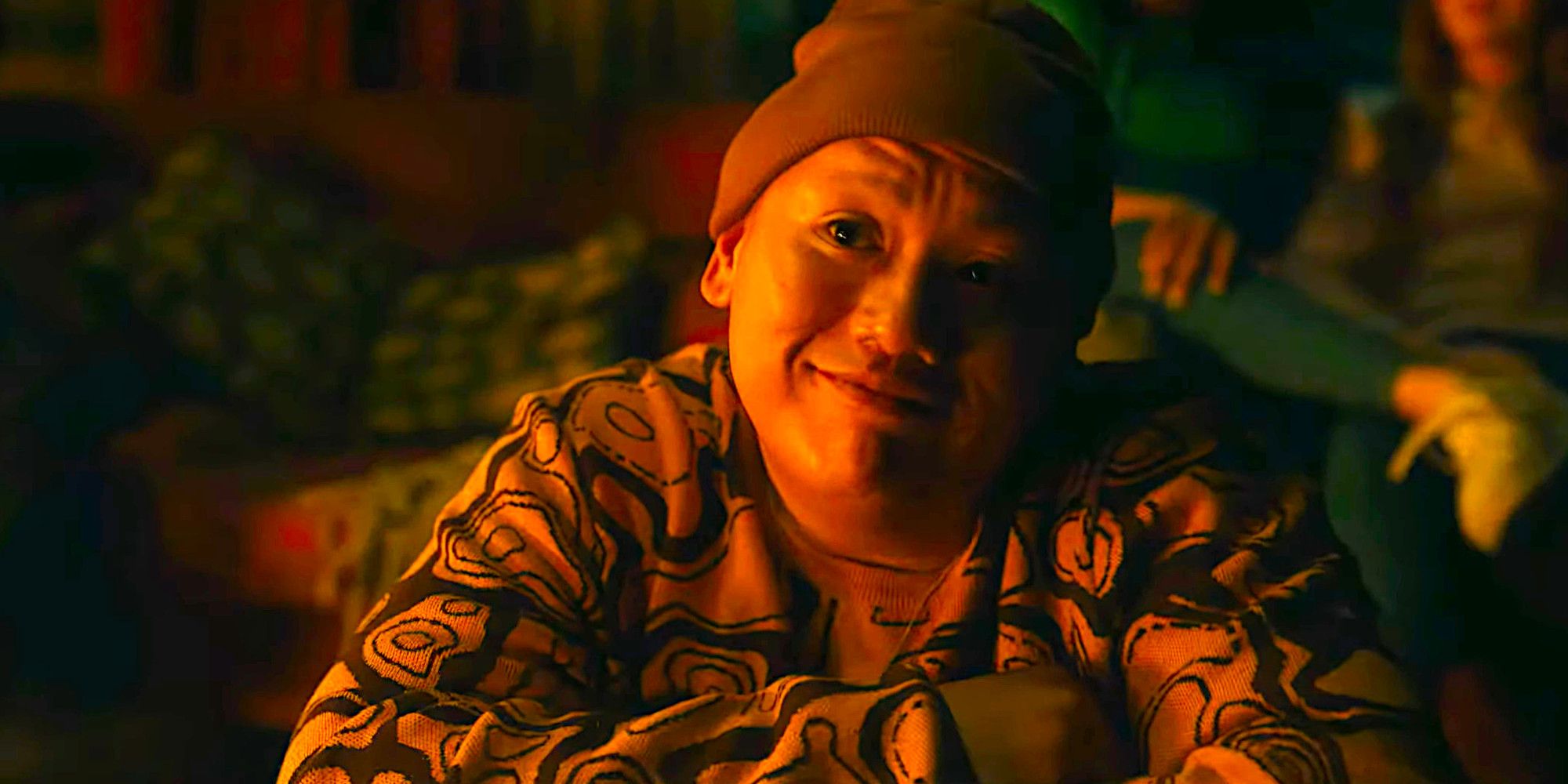 Jacob Batalon wears pajamas and a stocking cap and makes a smirking face in a scene from Tarot