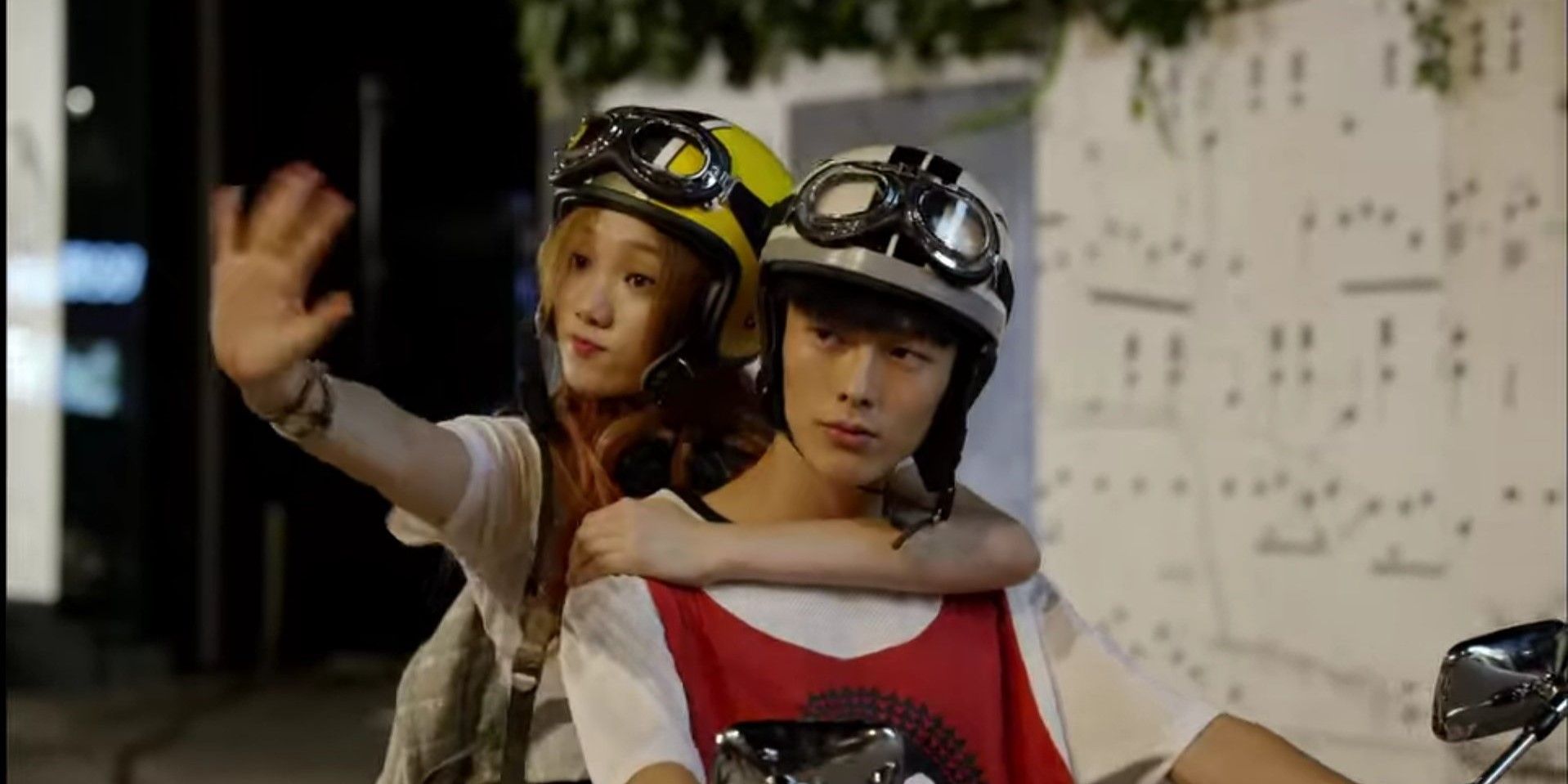 Jang Ki-young and Lee Sung-kyung in It's Okay That's Love riding a bike and wearing helmets