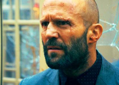 Jason Statham as Adam Clay frowning in The Beekeeper