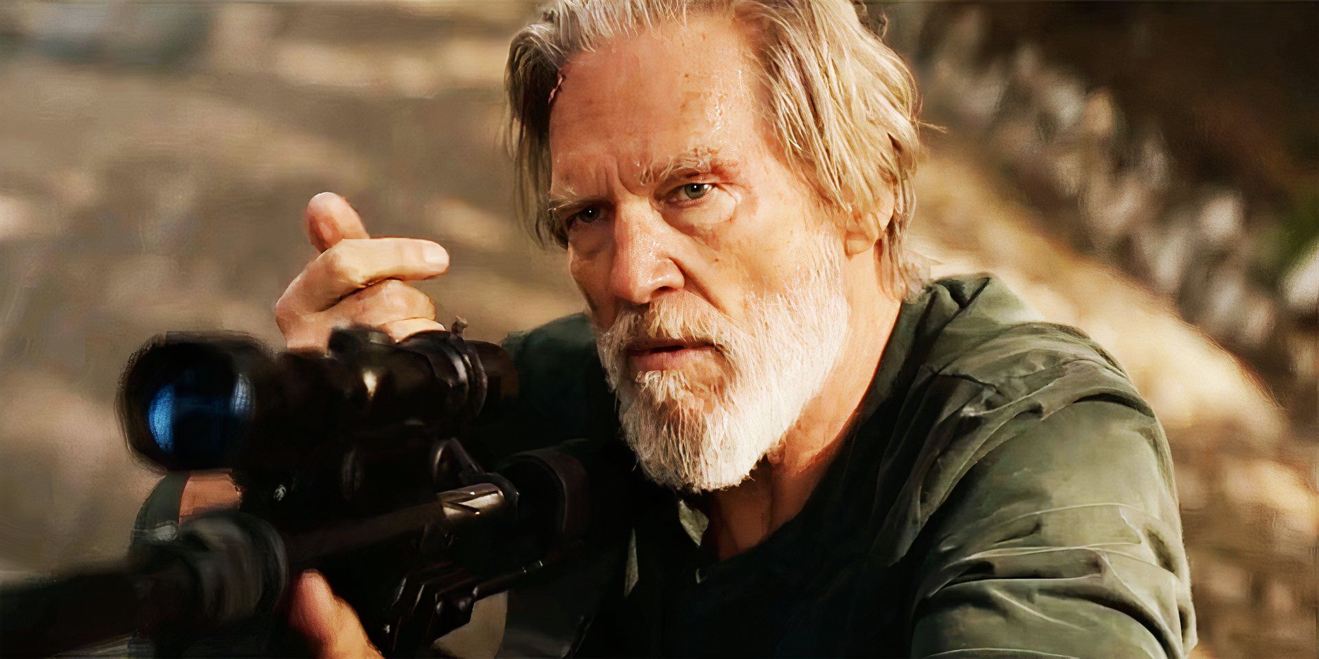 Jeff Bridges holding a gun in The Old Man