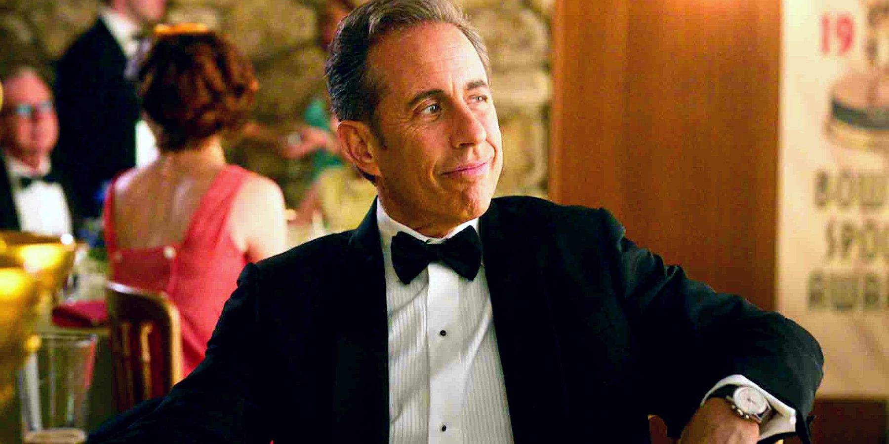 Jerry Seinfeld wearing a tux and looking smug in Unfrosted