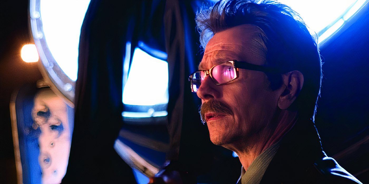 Jim Gordon stands in front of the bat signal in Batman Begins