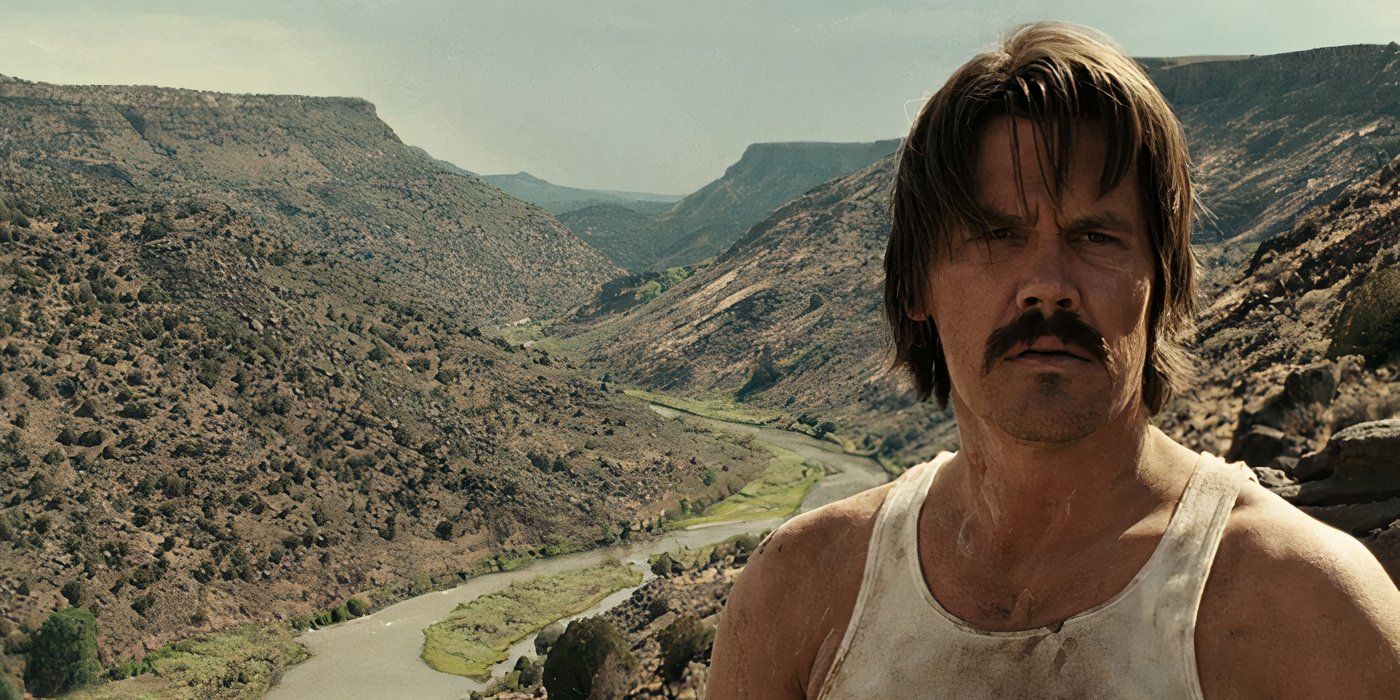 Josh Brolin standing in a valley in No Country for Old Men