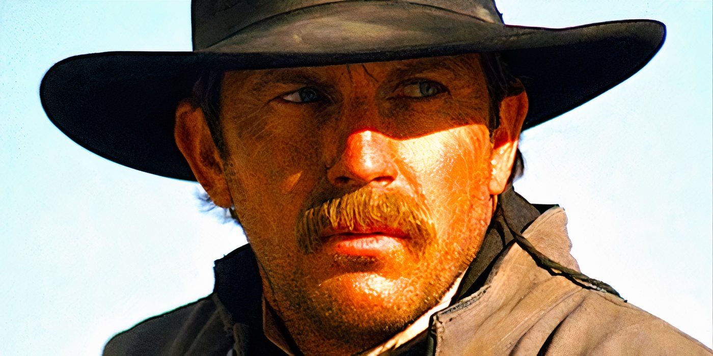 Kevin Costner glares from the shadows cast by the brim of his cowboy hat in a scene from Wyatt Earp