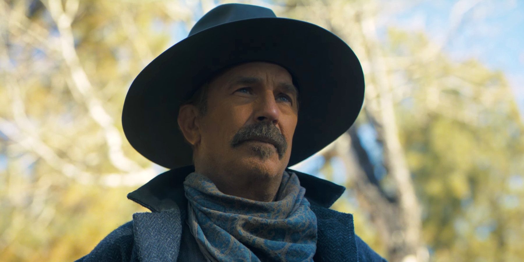 Kevin Costner in Horizon wearing a cowboy hat and looking stoically off into the distance