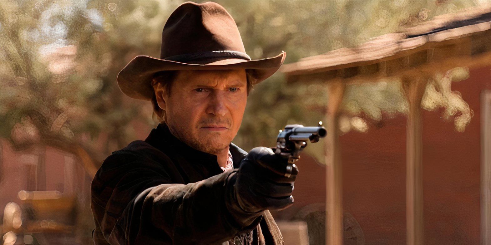 Liam Neeson as Clinch Leatherwood Pointing a Gun in A Million Ways to Die in the West