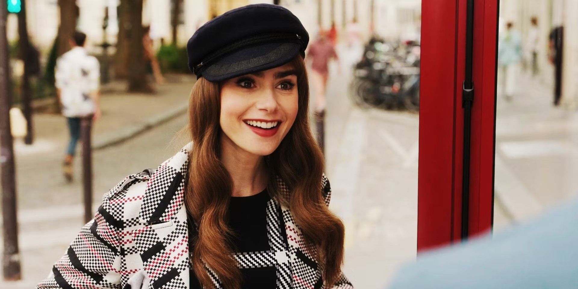 Lily Collins smiling in a scene from Emily in Paris season 3