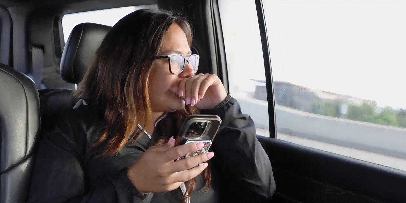 Liz Woods In 90 Day Fiance crying while talking on the phone next to car window