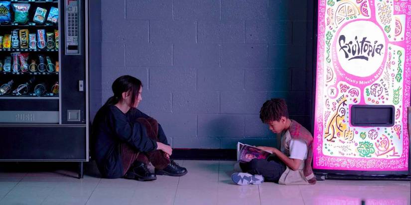 Maddy (Brigette Lundy-Paine) and Owen (Ian Foreman) look at the Pink Opaque episode guide in I Saw the TV Glow