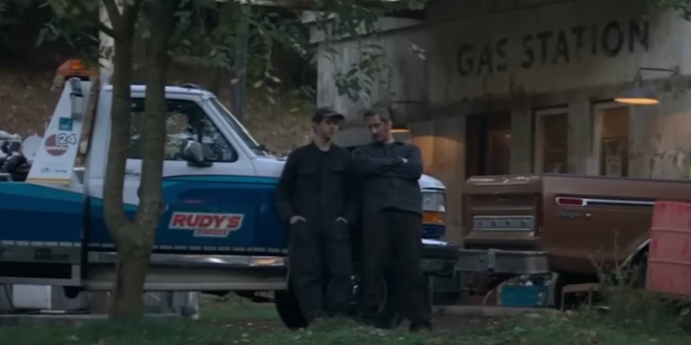 Mechanics leaning on car in The Strangers Chapter 1