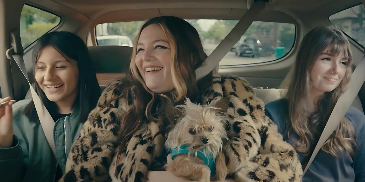 Megan Stalter as Cora awkwardly squeezed between two teenagers in a car while holding her dog in Cora Bora