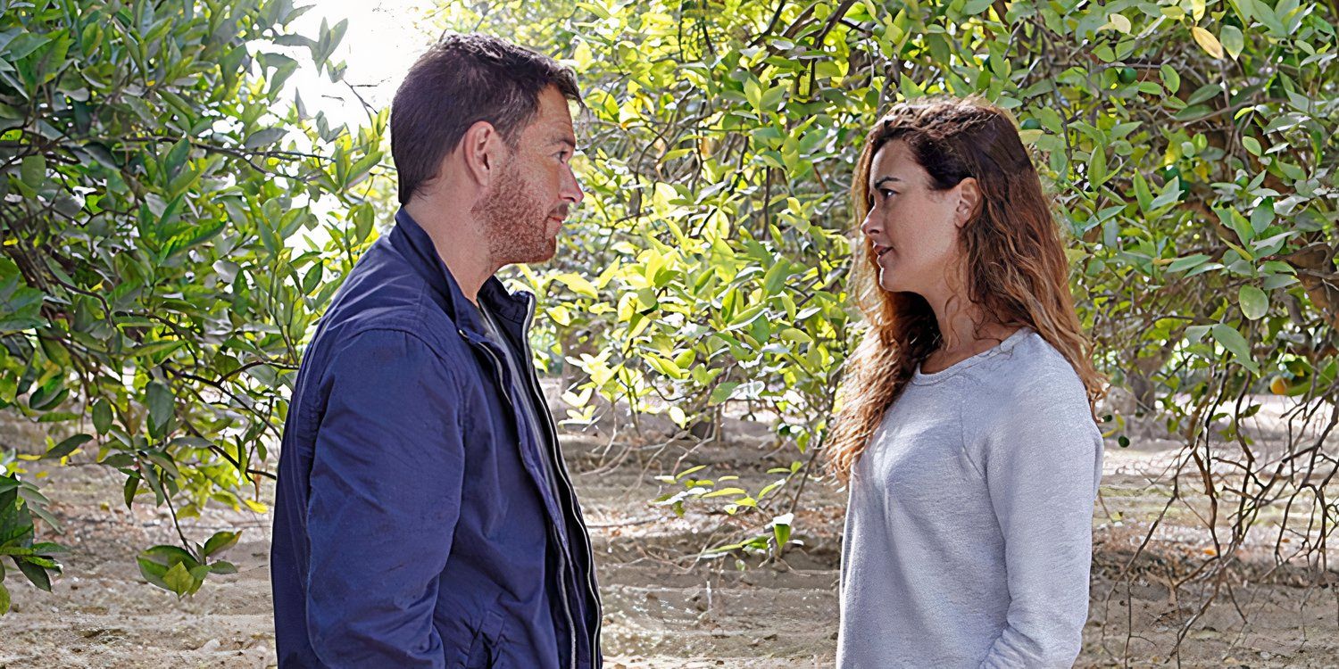 Michael Weatherly as Tony DiNozzo and Cote de Pablo as Ziva David talking outside amid trees in NCIS