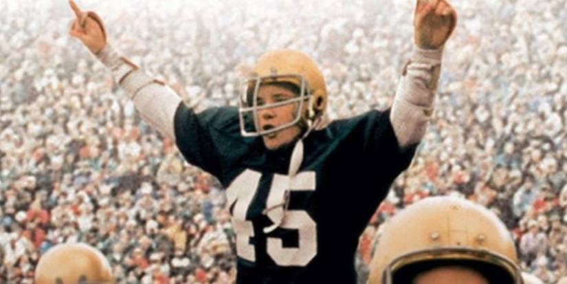 Rudy (Sean Astin) cheering on the field in Rudy