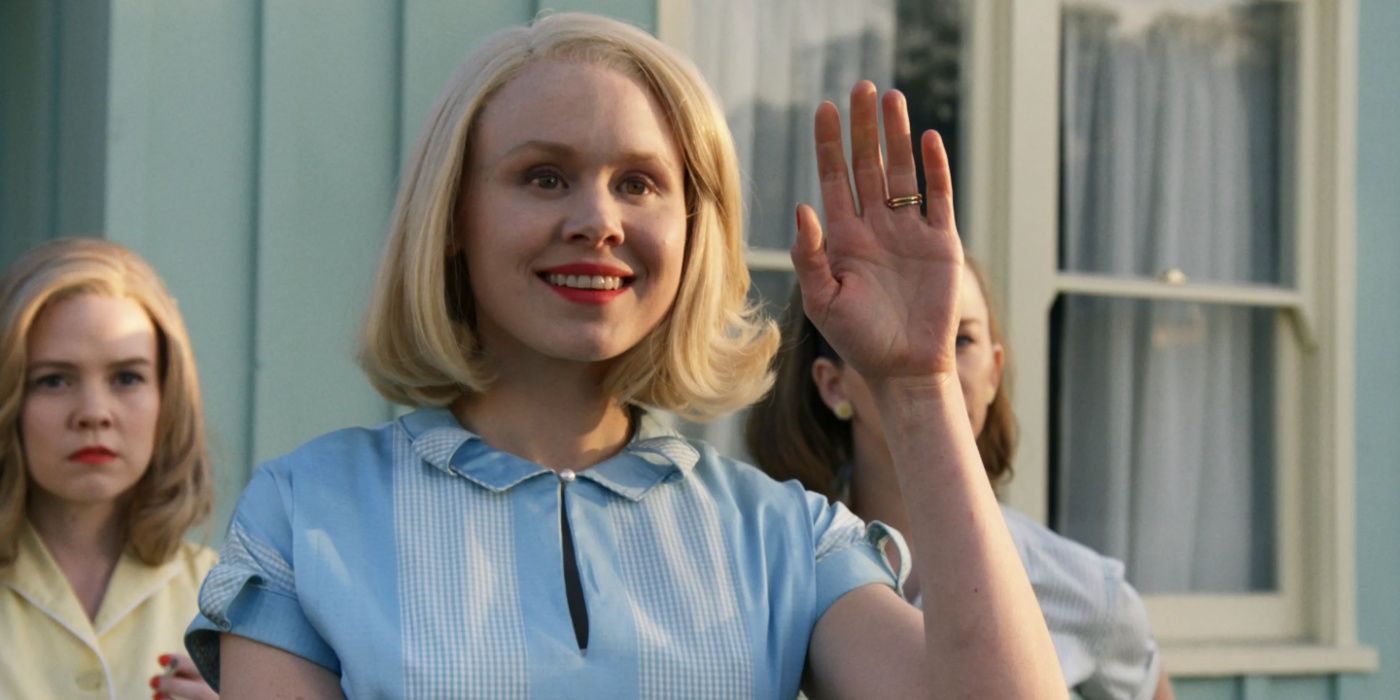 Betty (Alison Pill) waves at the Emory family in Them