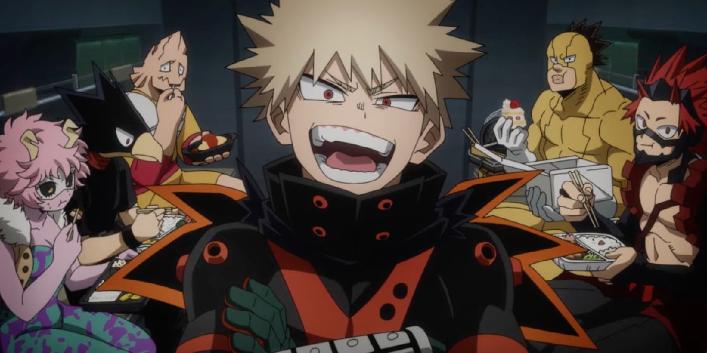 My Hero Academia You&rsquo;re Next&rsquo;s Bakugo smiling with other class 1-A members eating behind him.