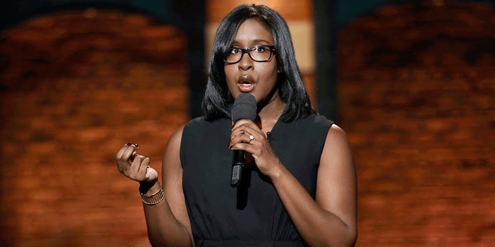 Naomi Ekperigin performing standup