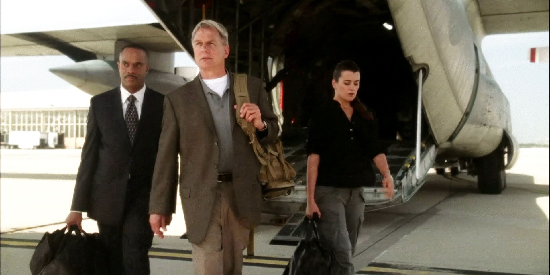 Mark Harmon as Leroy Gibbs and Cote de Pablo as Ziva David descending a plane as they arrive in Israel in NCIS