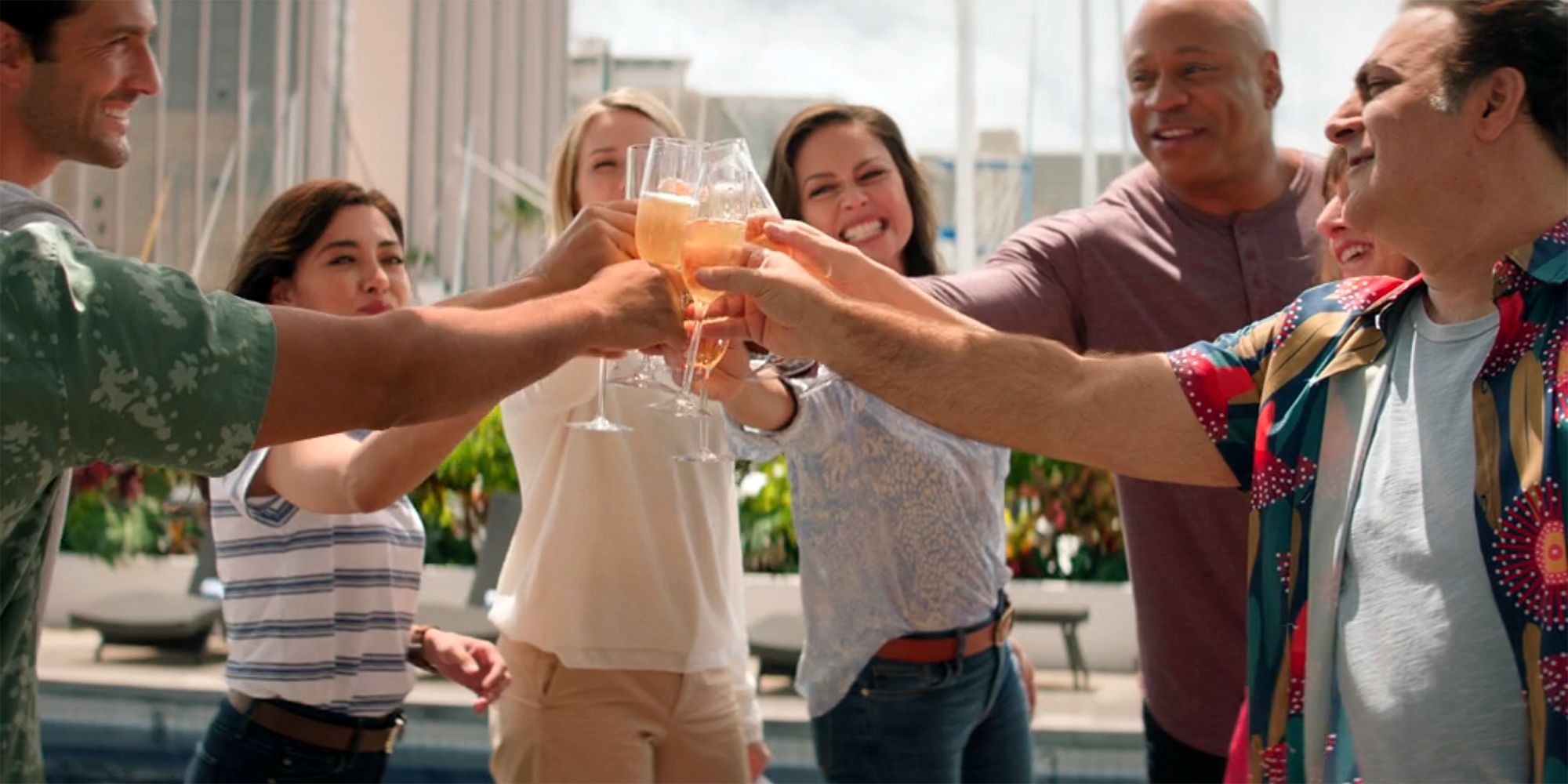 The cast of NCIS: Hawaii toasting in the season 3 finale