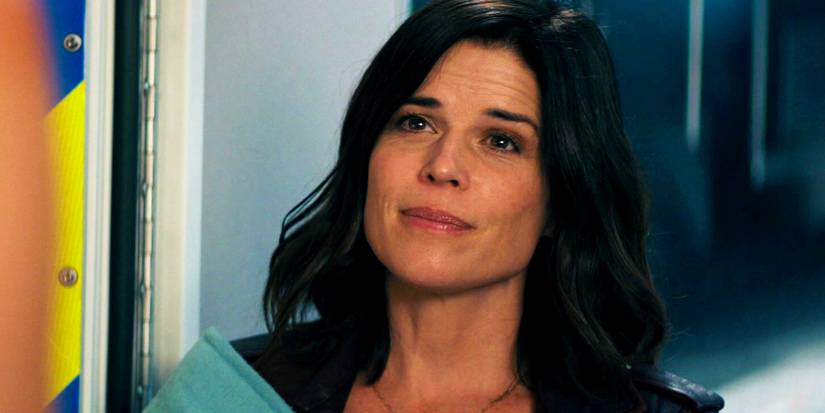 Neve Campbell smiling as Sidney Prescott in 2022's Scream