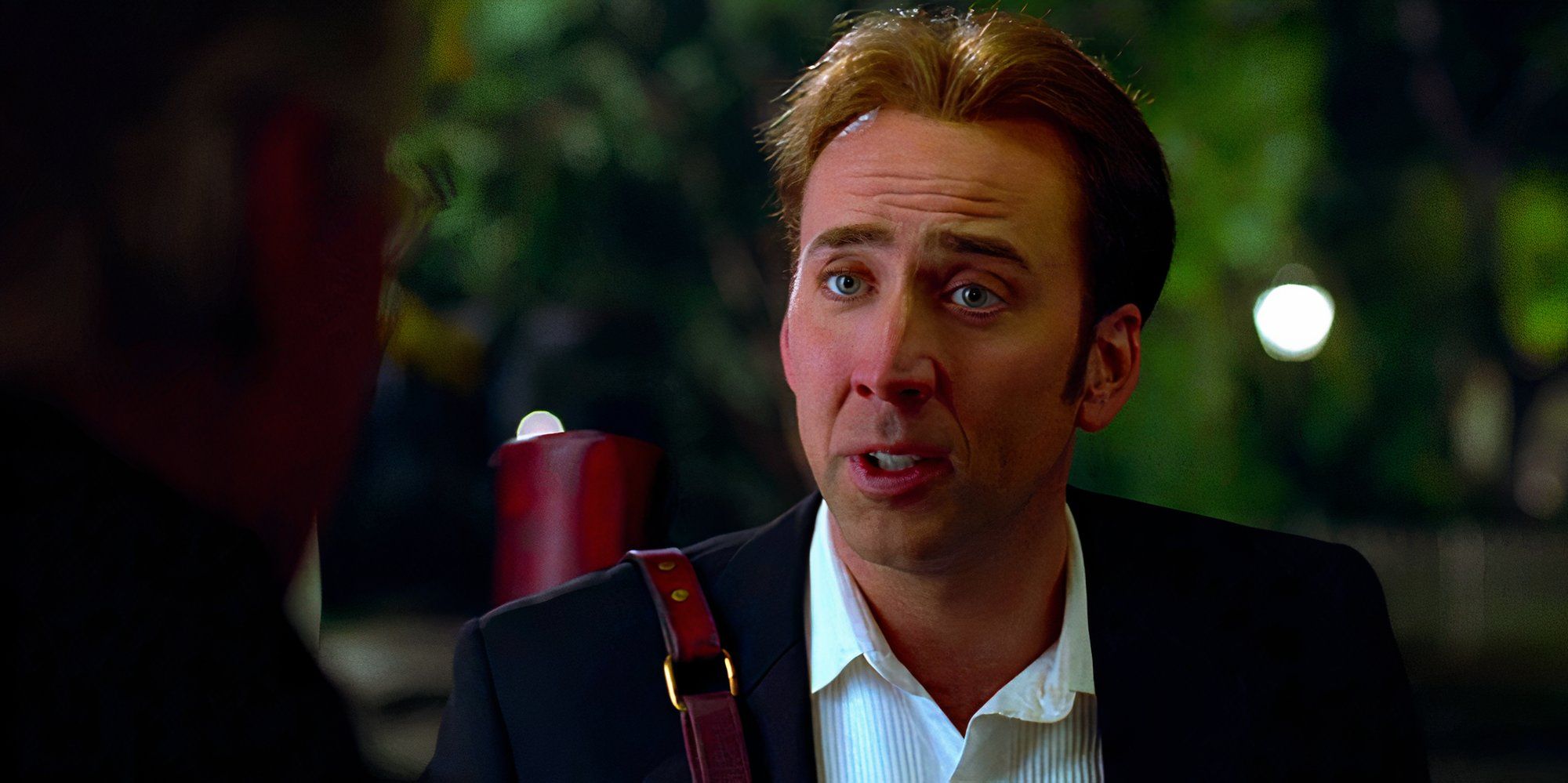 Nicolas Cage engages in conversation in a scene from National Treasure