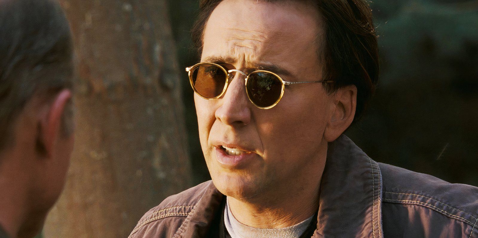 Nicolas Cage wearing sunglasses as Ben Gates in National Treasure 2