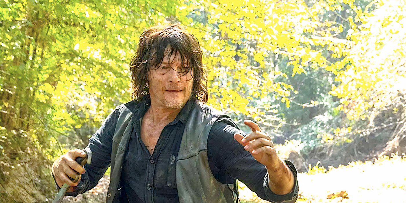 Norman Reedus's Daryl Dixon holding a knife in the woods in The Walking Dead season 10