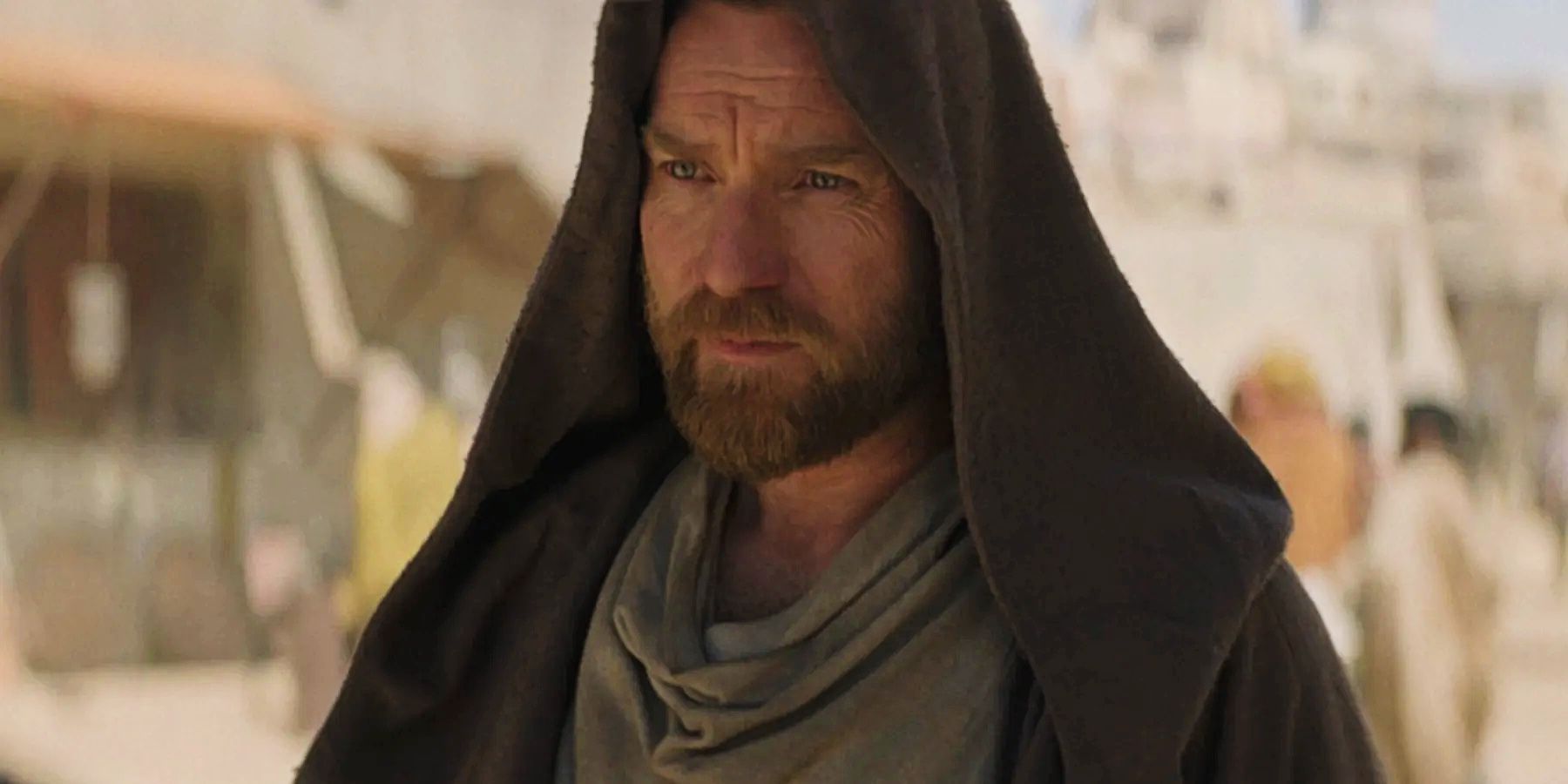 Ewan McGregor looking serious with his hood raised in the Obi-Wan Kenobi series on Disney Plus.