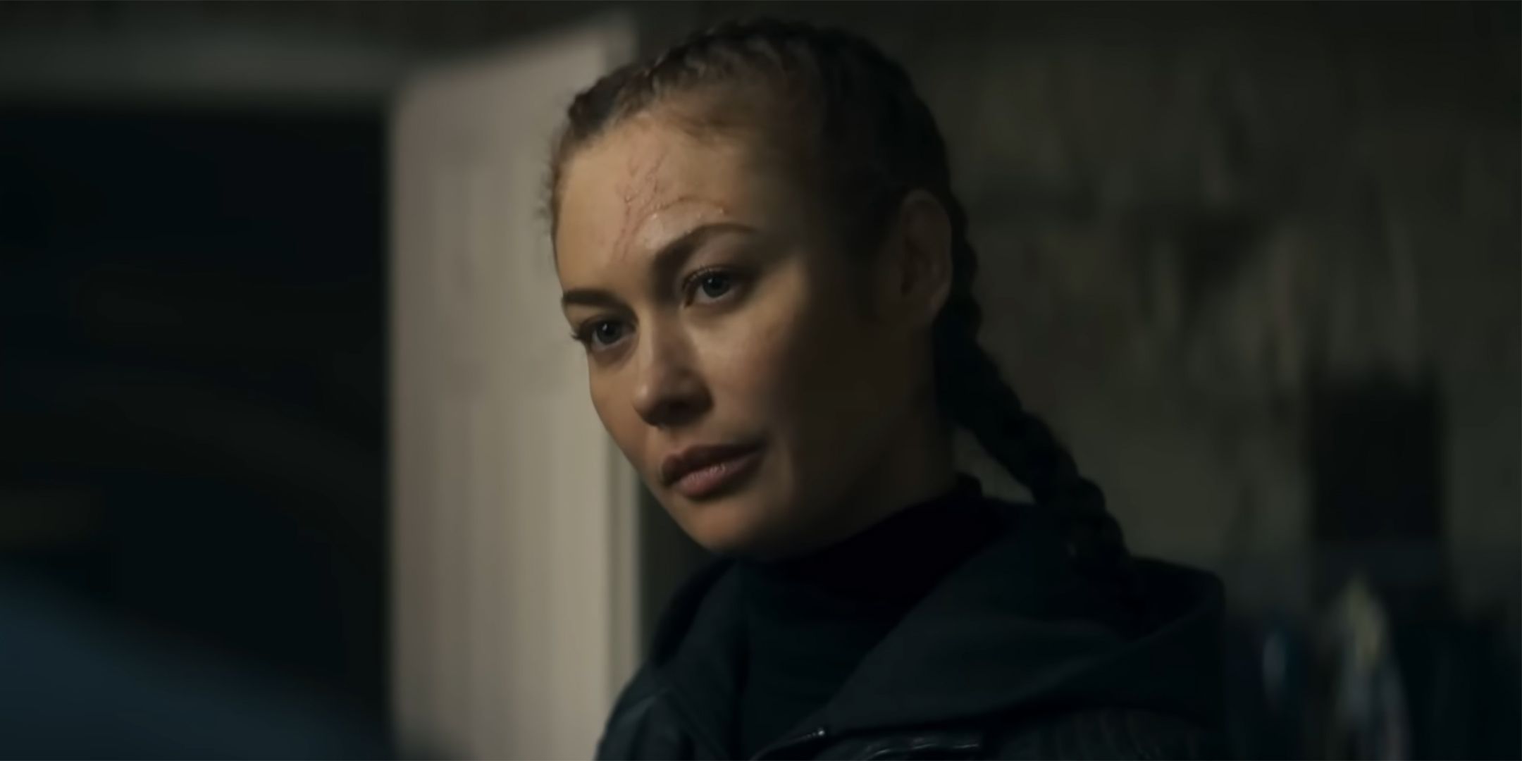 Olga Kurylenko as Krystyna looking intrigued in Chief of Station